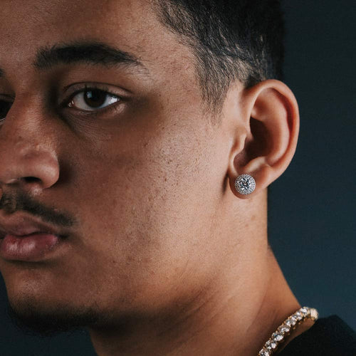 man wearing moissanite double halo earrings