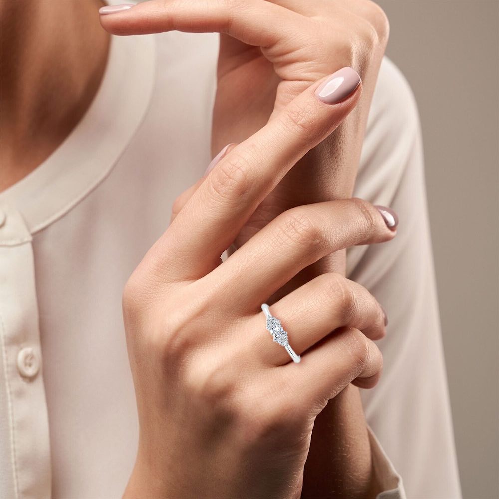 Round Cut Petite Moissanite Engagement Ring hand