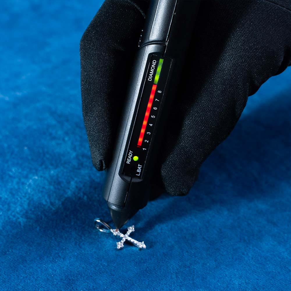 small moissanite fleur cross pendant diamond tester