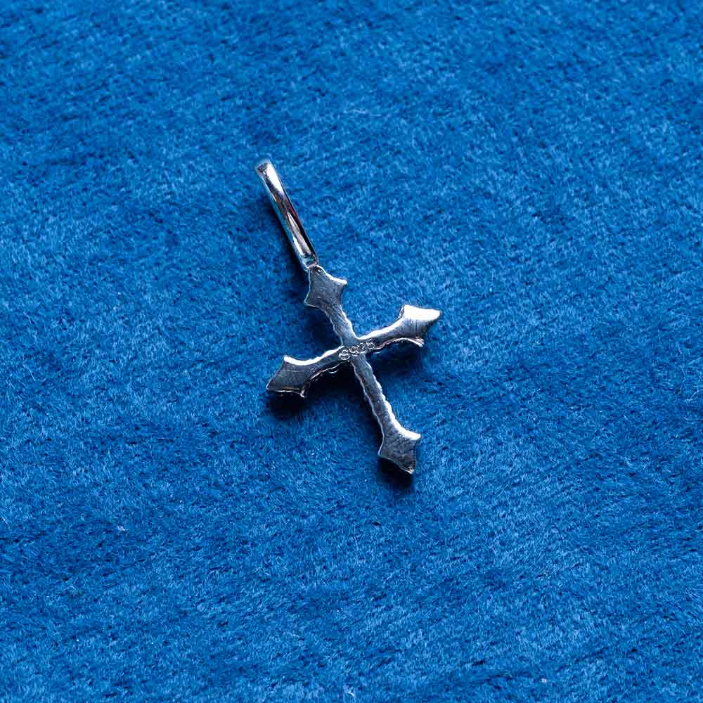 small moissanite fleur cross pendant solid back