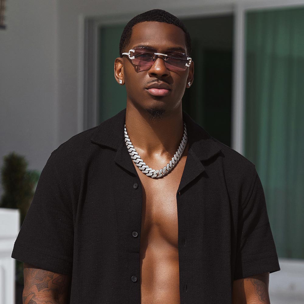 icecartel man wearing moissanite 4 row cuban link chain and moissanite glasses