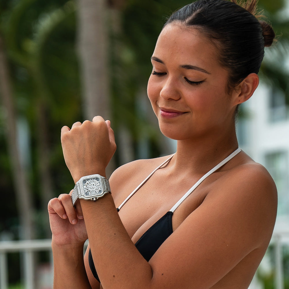 icecartel woman wearing moissanite skeleton watch