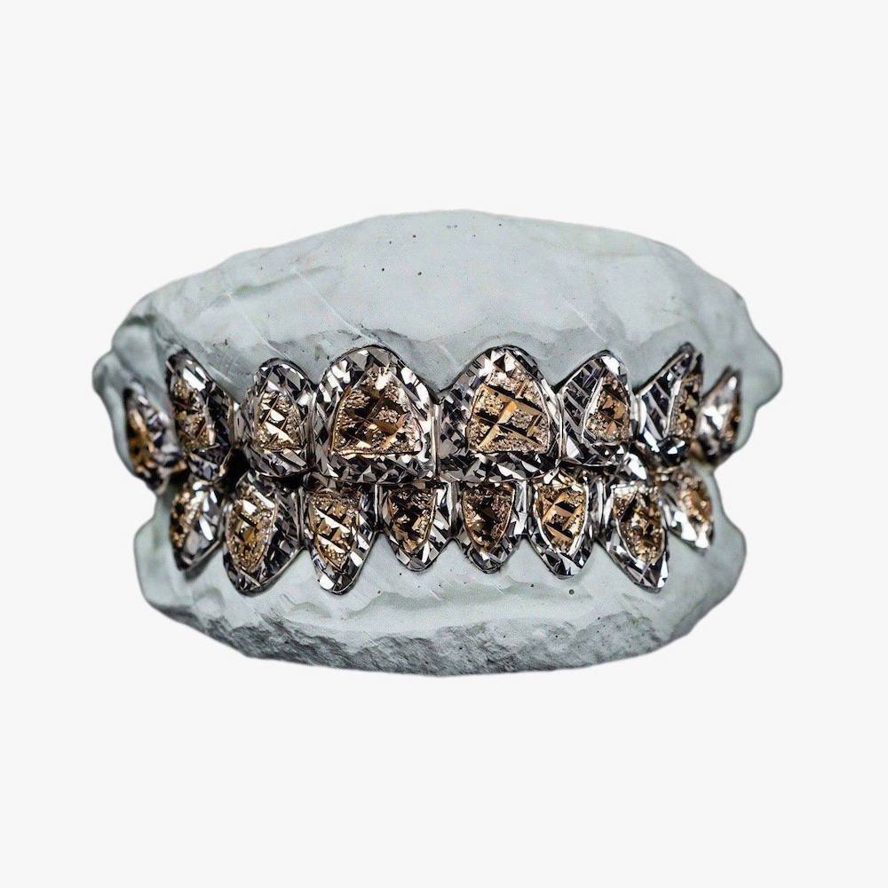 Two tone diamond cut grillz first